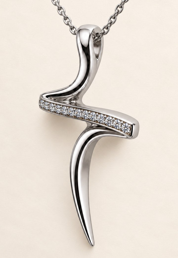 The cross pendant in 18ct white gold, three-quarter view, moissanite pavé along the crossbar